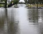 Man found dead in Queensland flood waters as state hit by multiple storms and days-long deluge