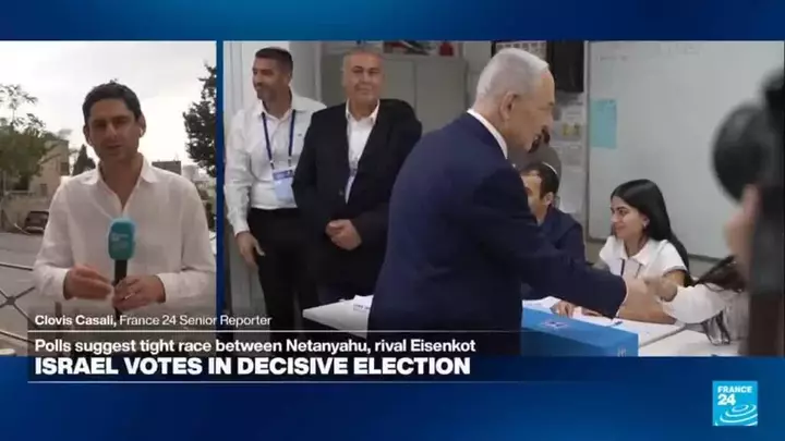 Israeli PM casts his ballot as voters voice opposition to Netanyahu outside polling stations