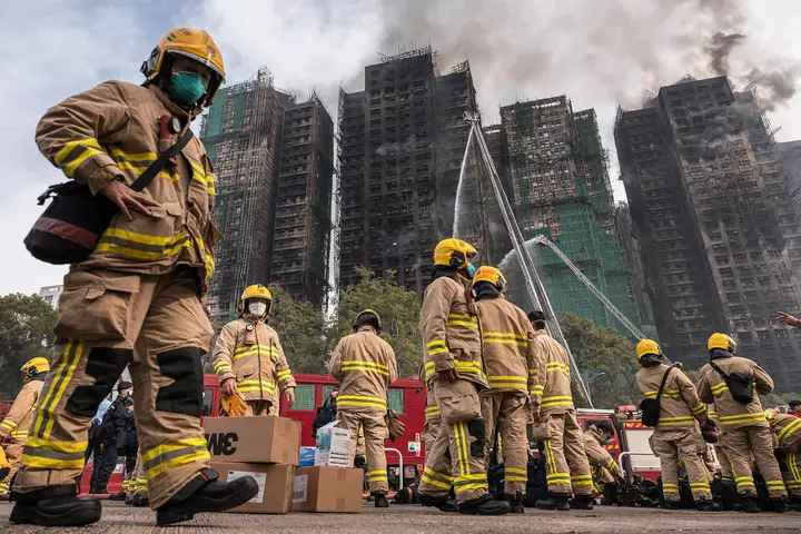Hong Kong leader apologizes for deadly fire that tested Beijing’s grip on city