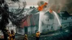 Evacuation orders as fast-moving California wildfire burns homes
